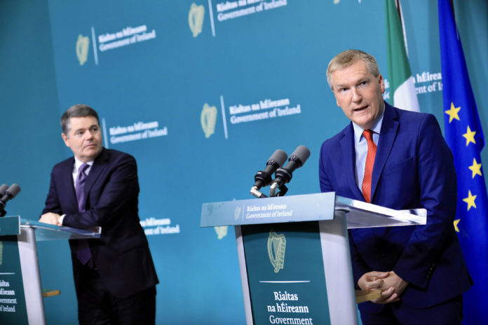 Minister Michael McGrath and Minister Paschal Donohoe speaking at a press conference